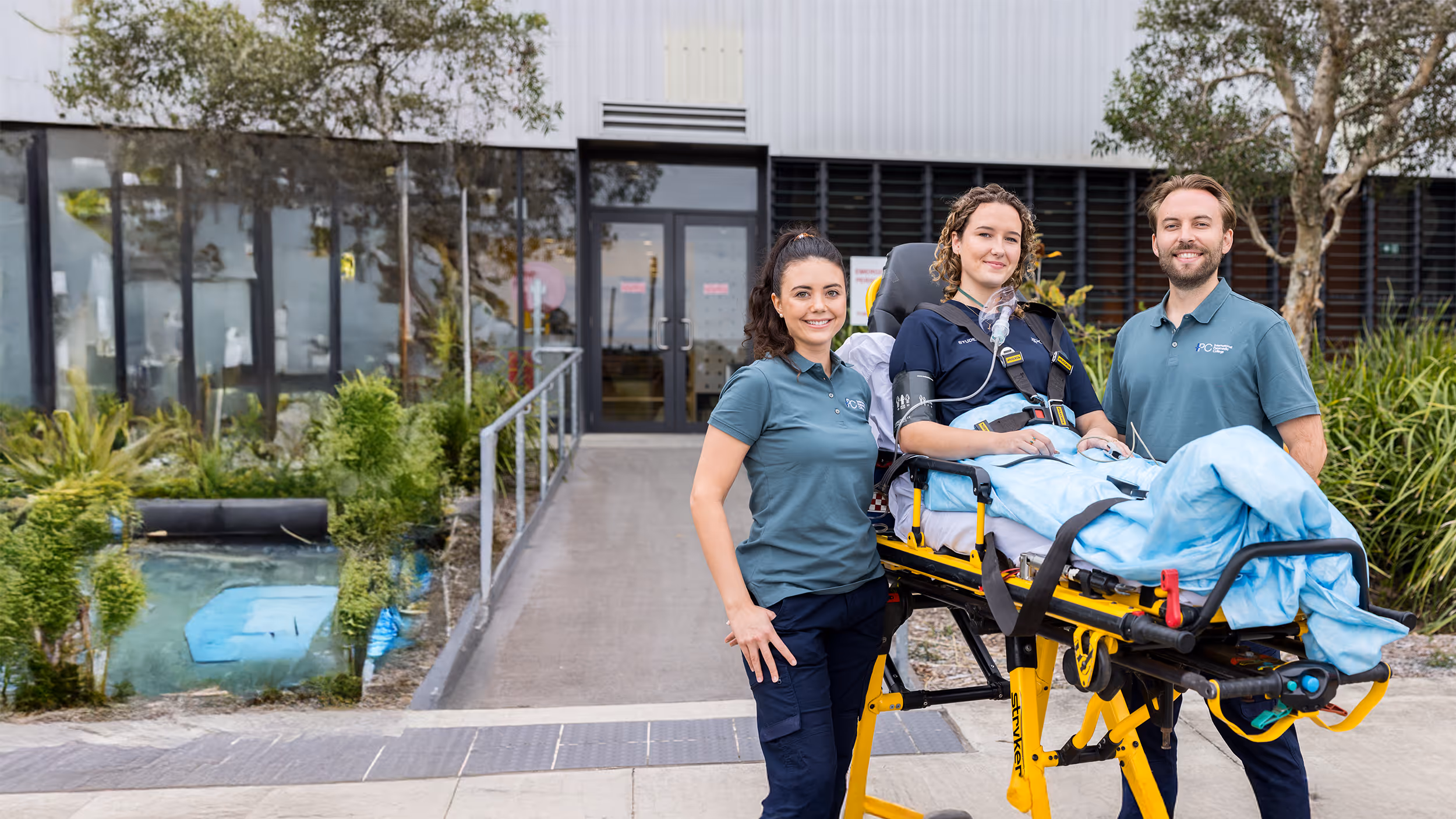 Paramedics standing in front of an ambulance