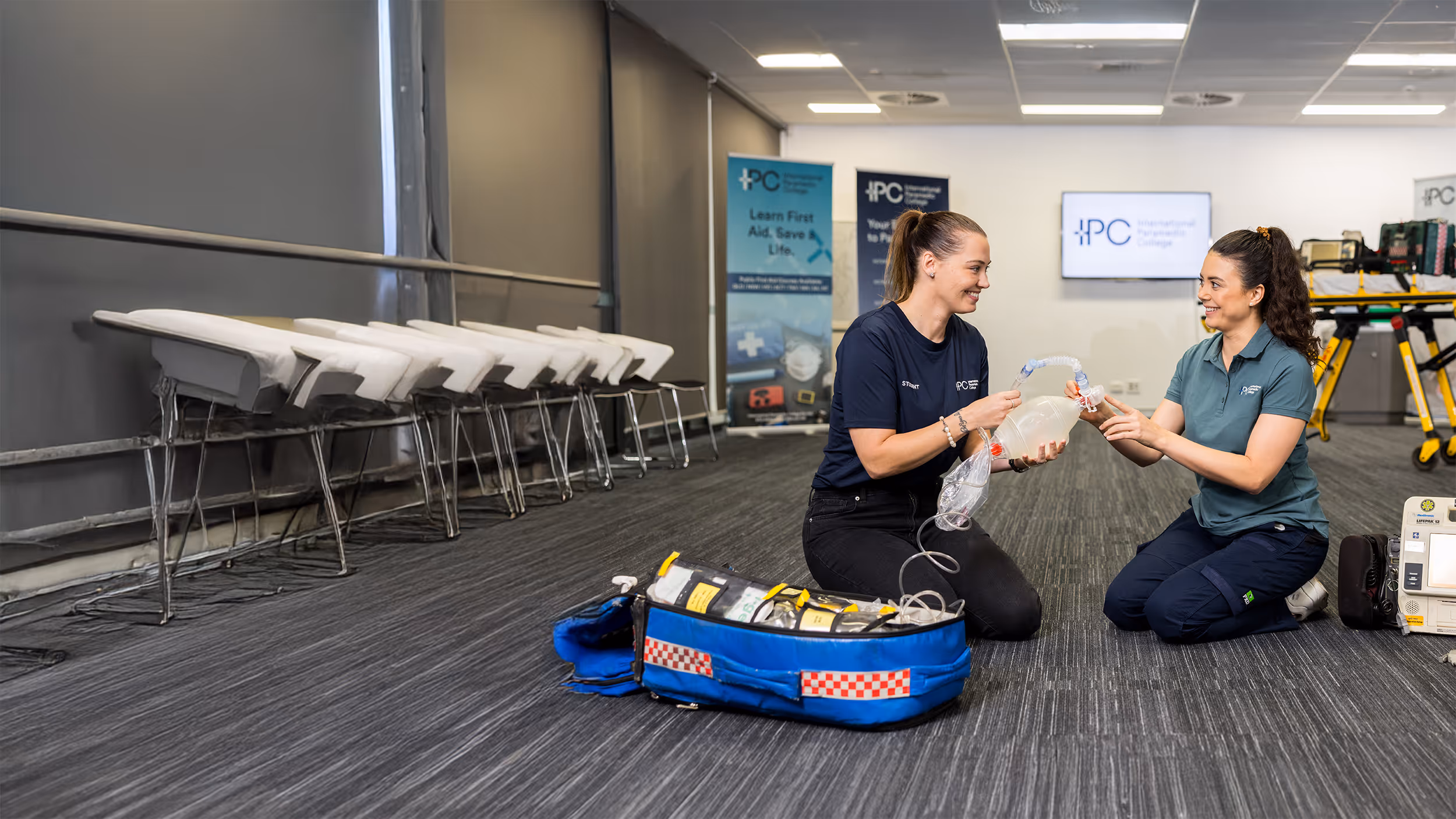 IPC students in paramedic uniforms during a training session at the college
