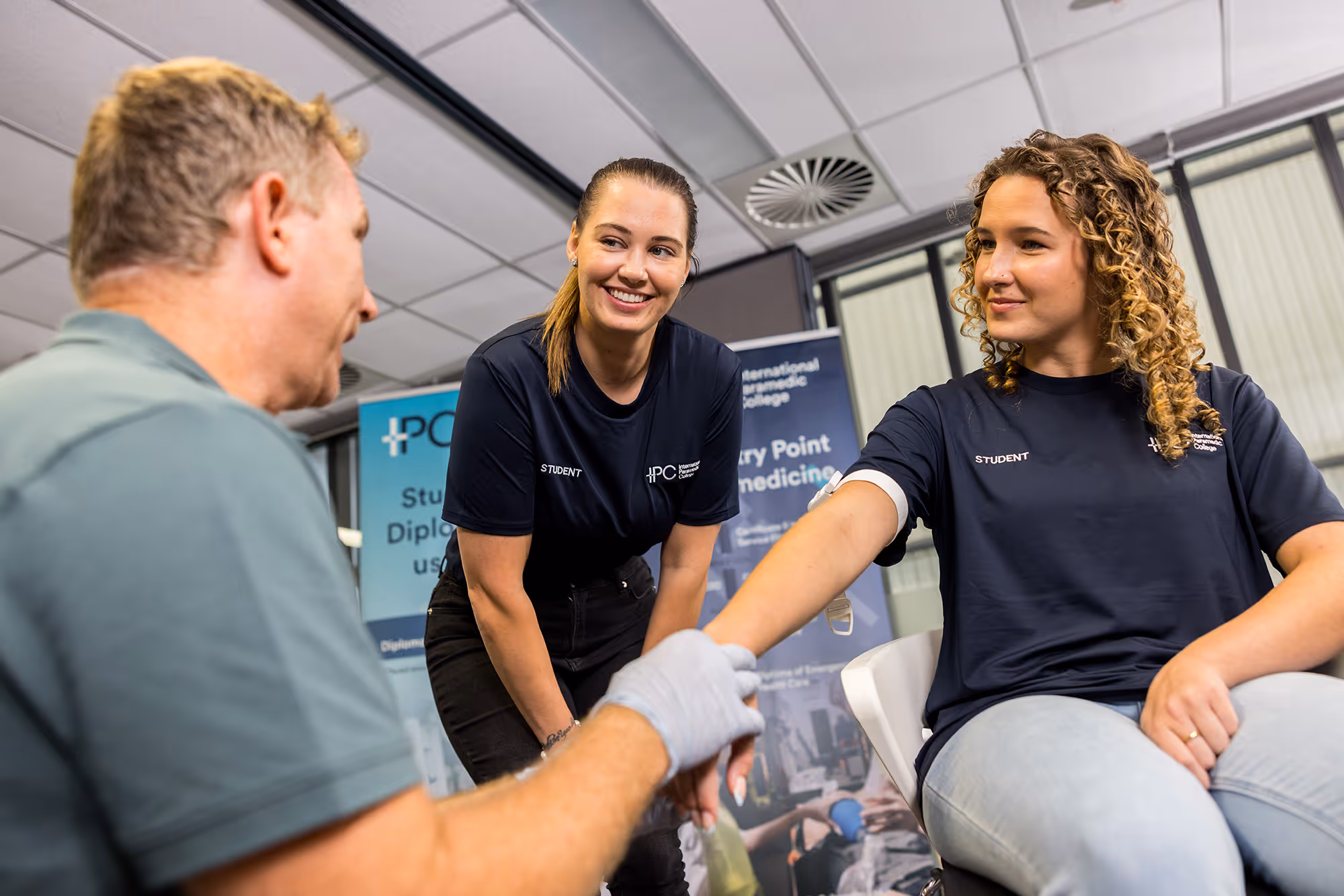 IPC students practicing patient assessment and emergency care techniques