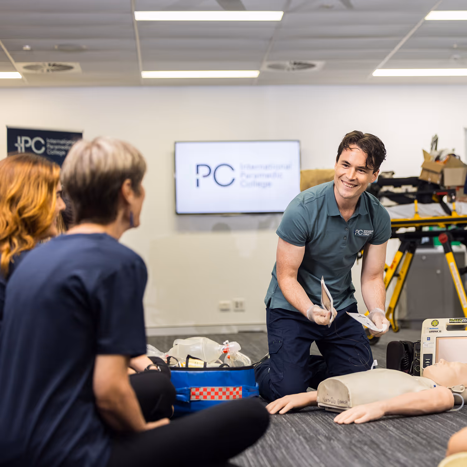 Group of IPC paramedic students collaborating during a practical training assessment