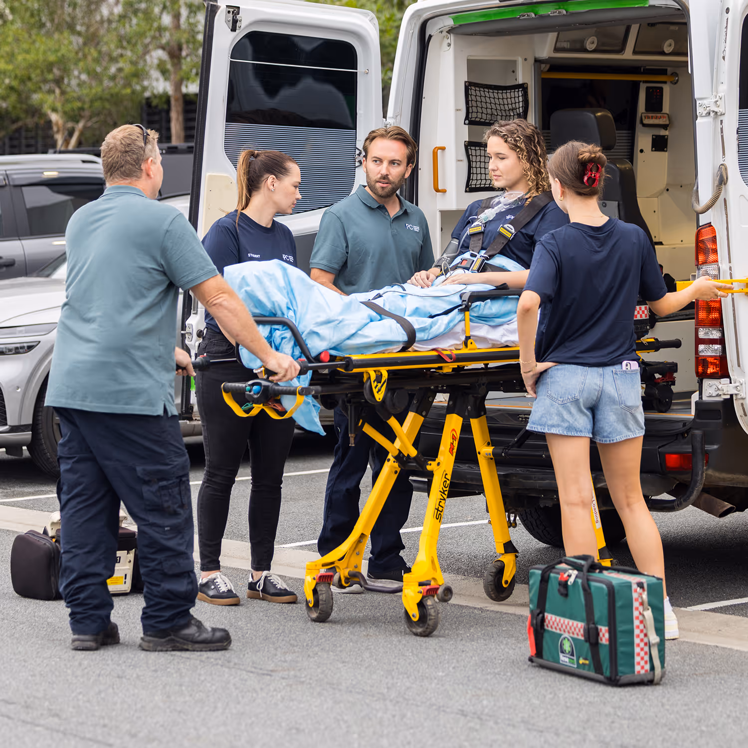 IPC students practicing hands-on emergency medical skills during a paramedic training session
