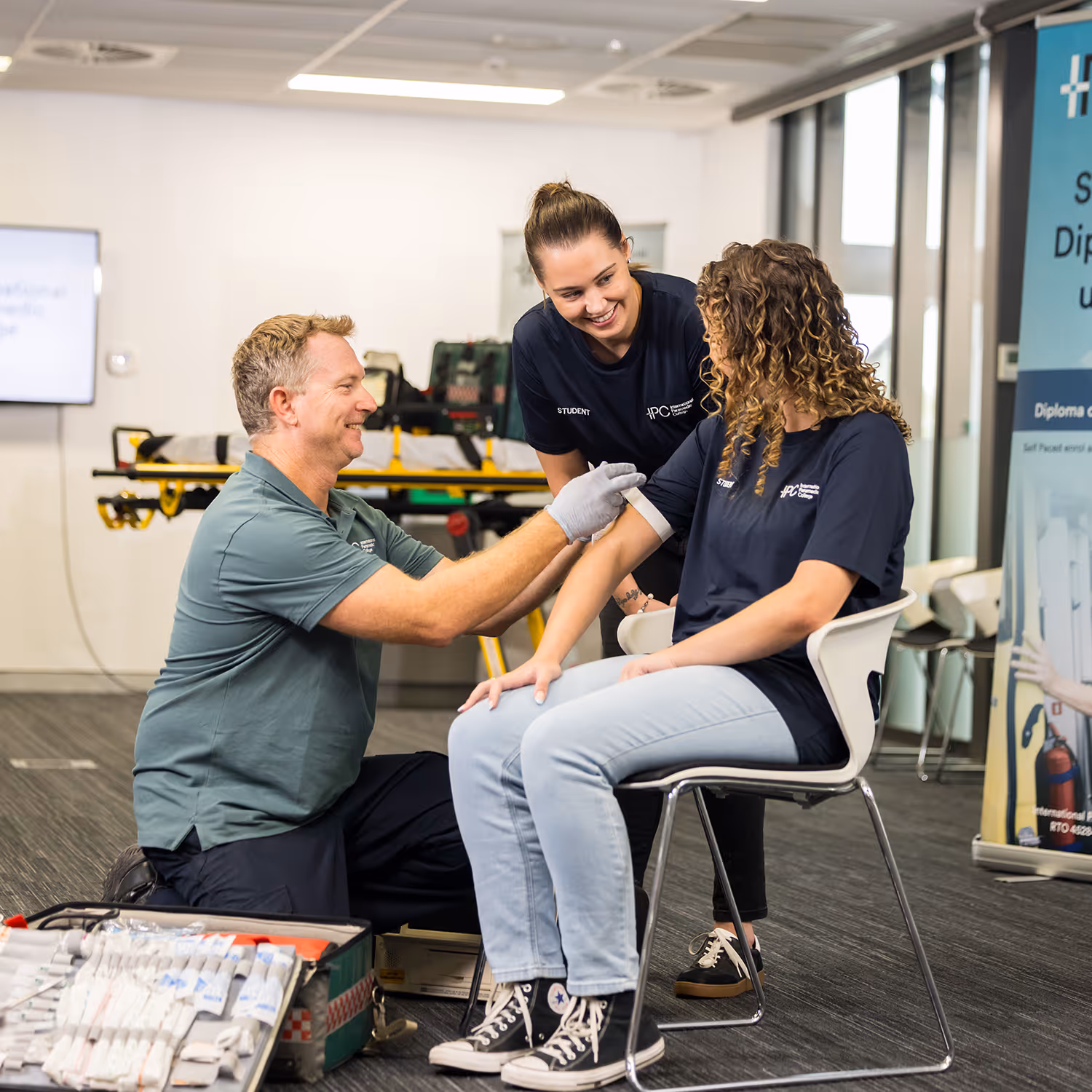 IPC students and trainers in a classroom or lab during a paramedic education session