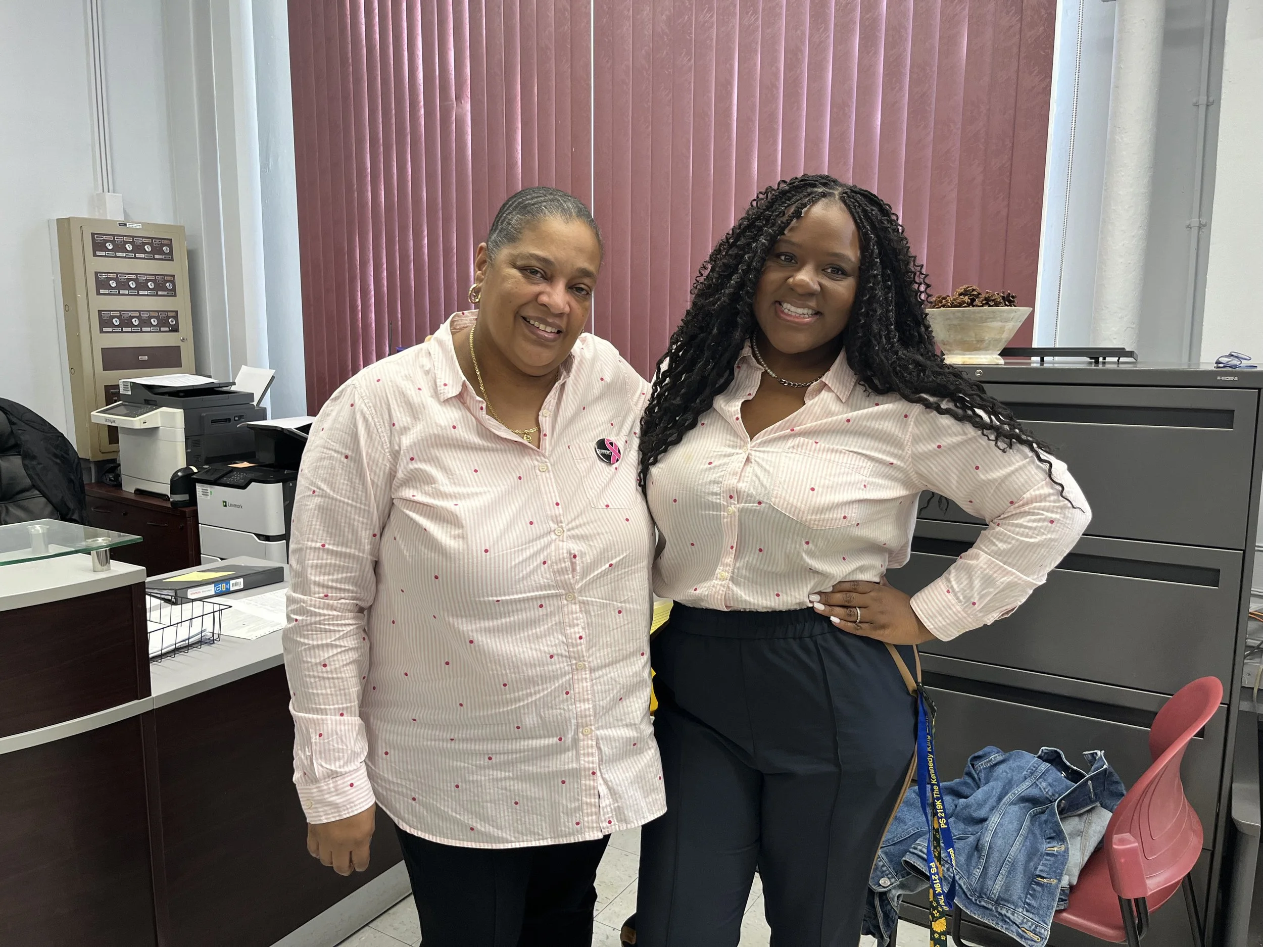 Two women smiling and posing together 