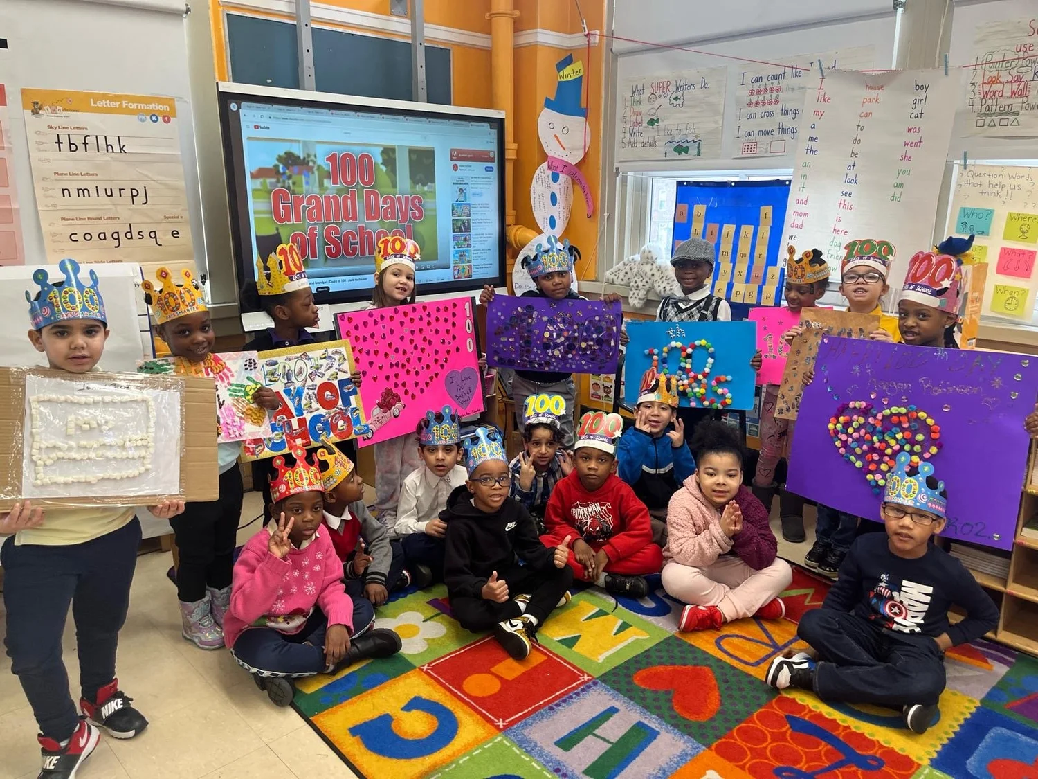 Group of young students wearing decorated crowns 