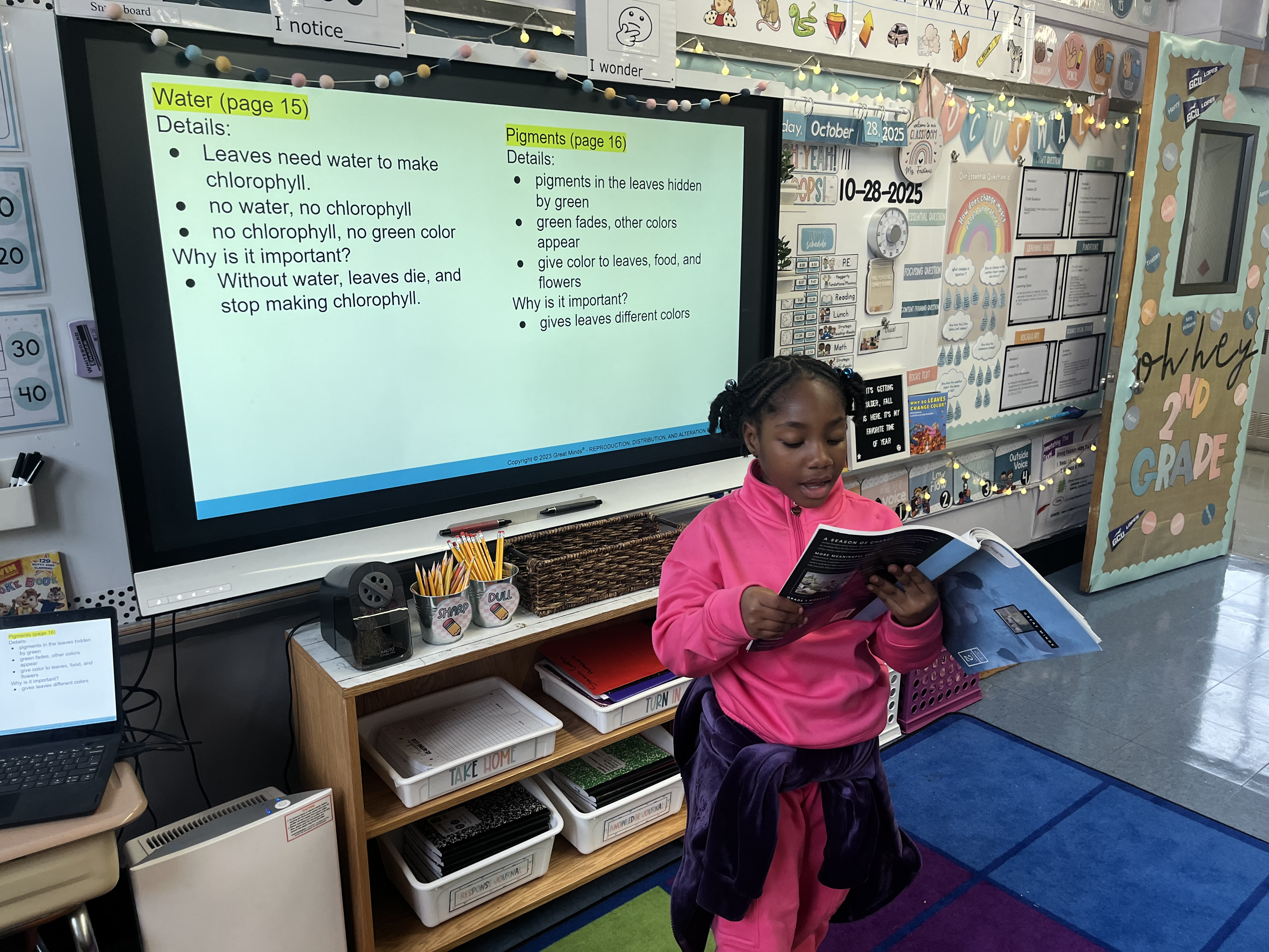 Five children standing on a polished gym floor 