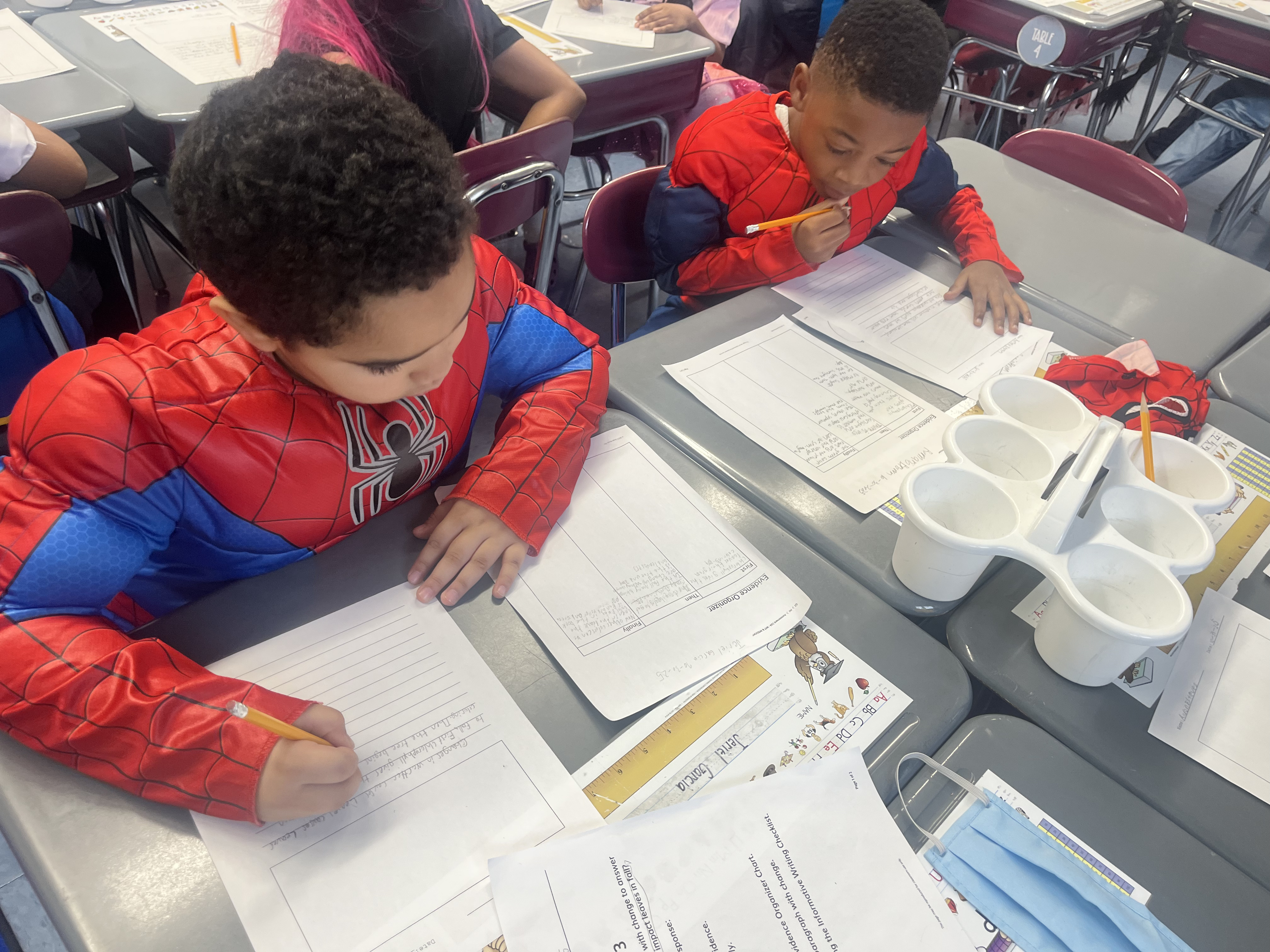 Five children standing on a polished gym floor 