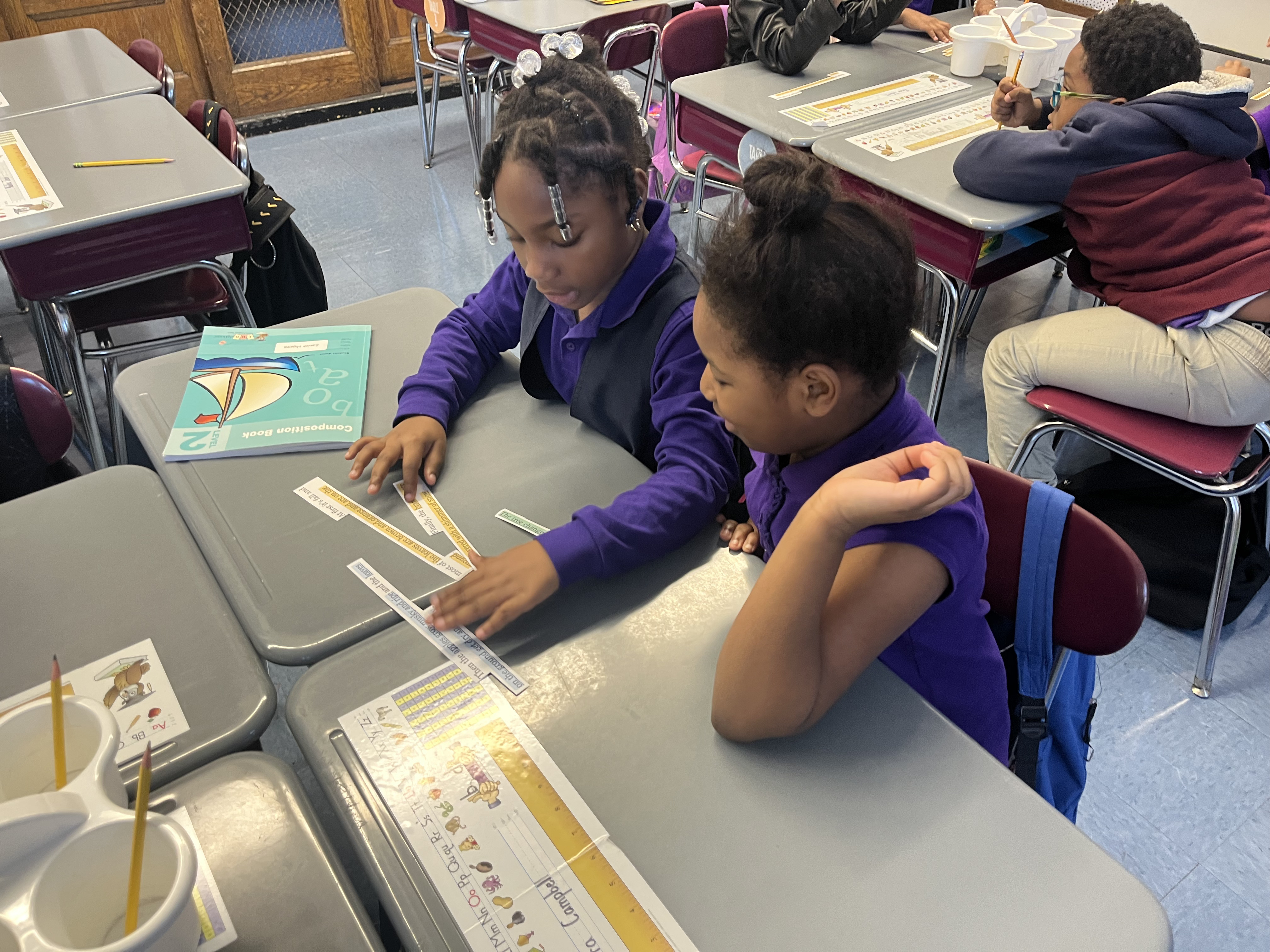 Five children standing on a polished gym floor 