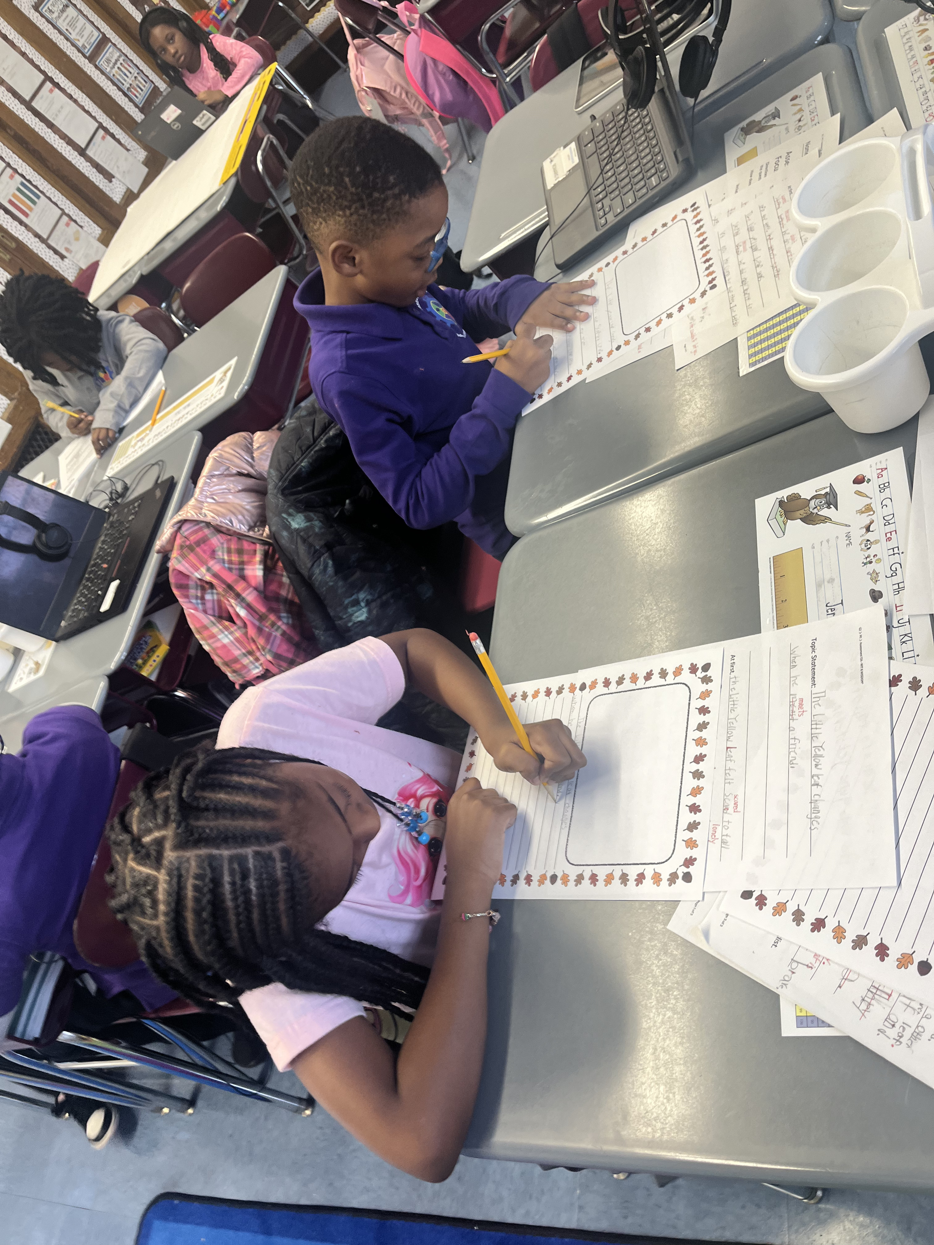 Five children standing on a polished gym floor 