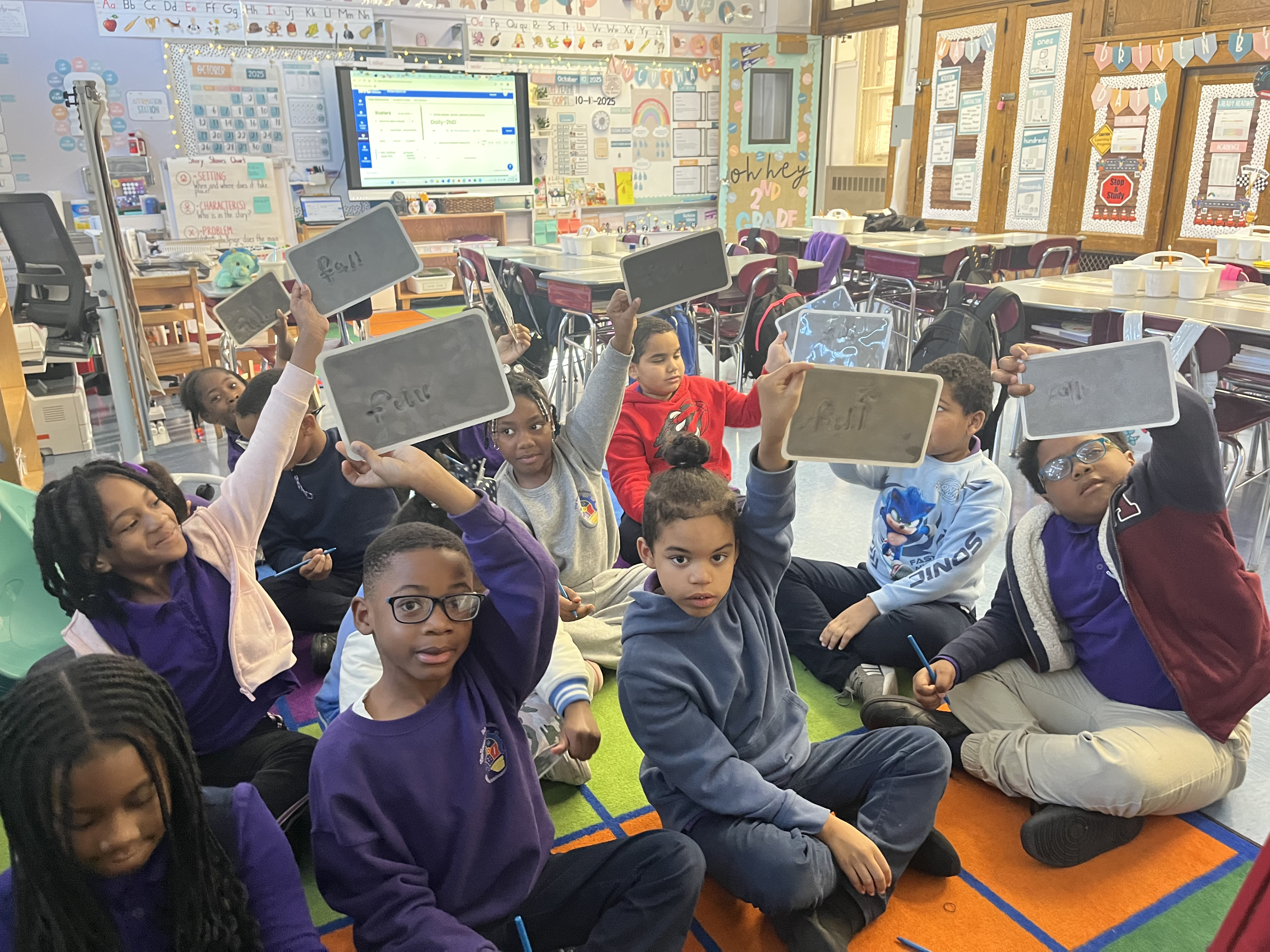 Five children standing on a polished gym floor 
