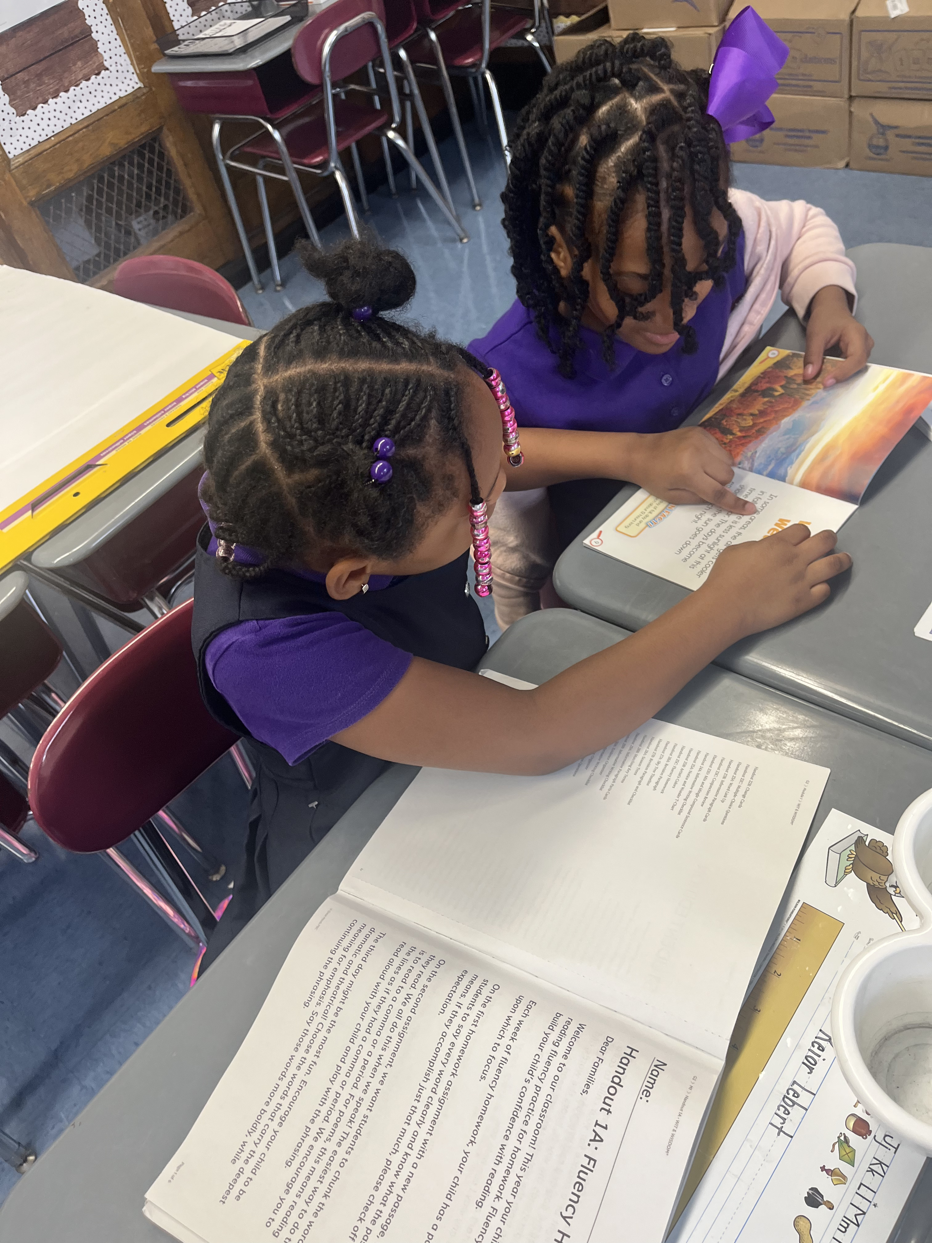 Five children standing on a polished gym floor 
