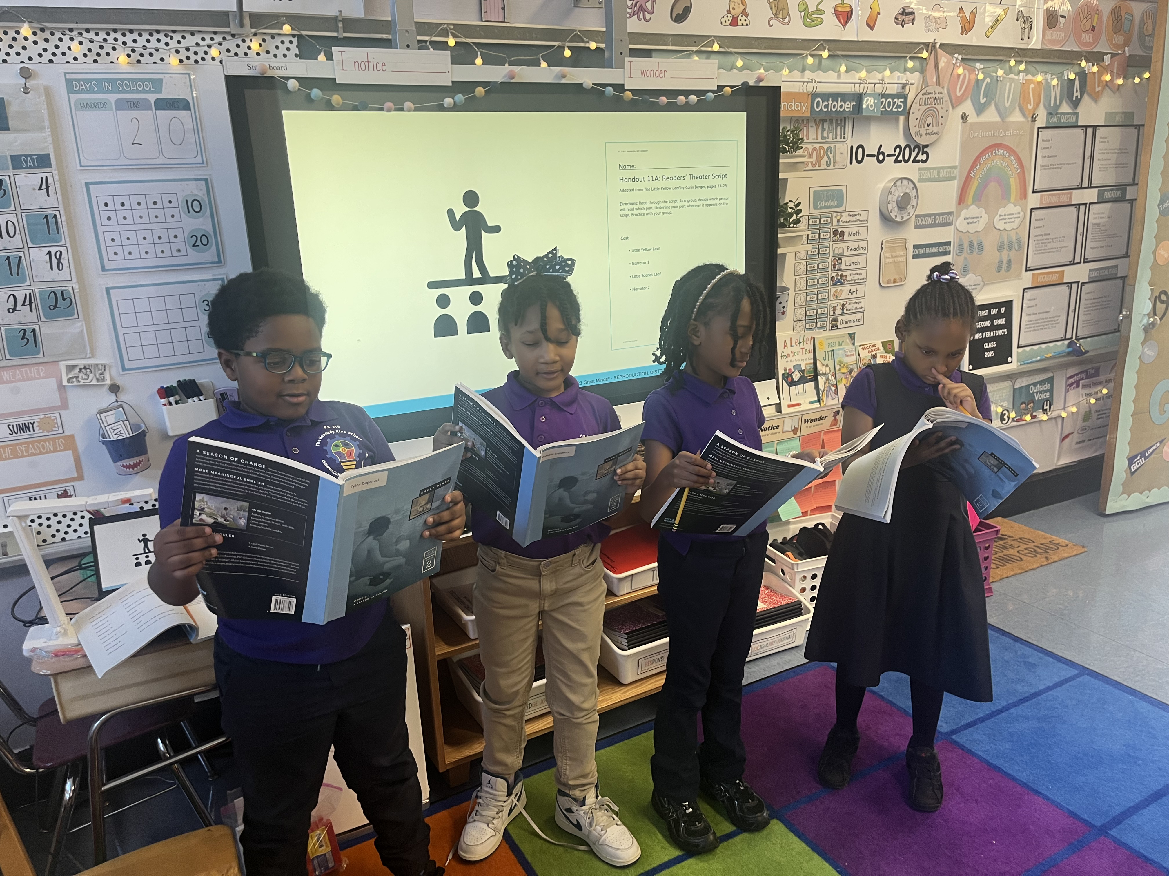 Five children standing on a polished gym floor 