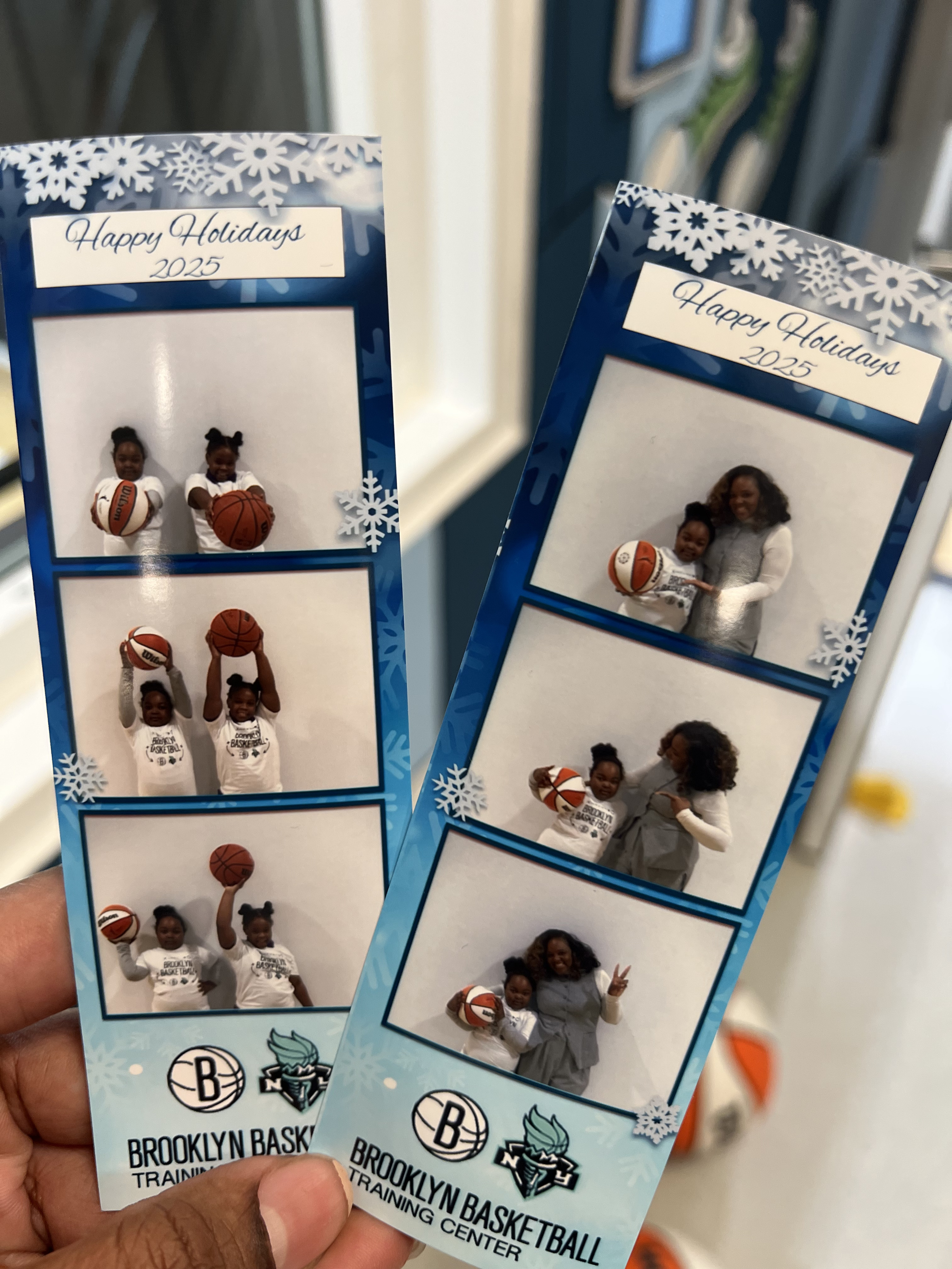 Five children standing on a polished gym floor 