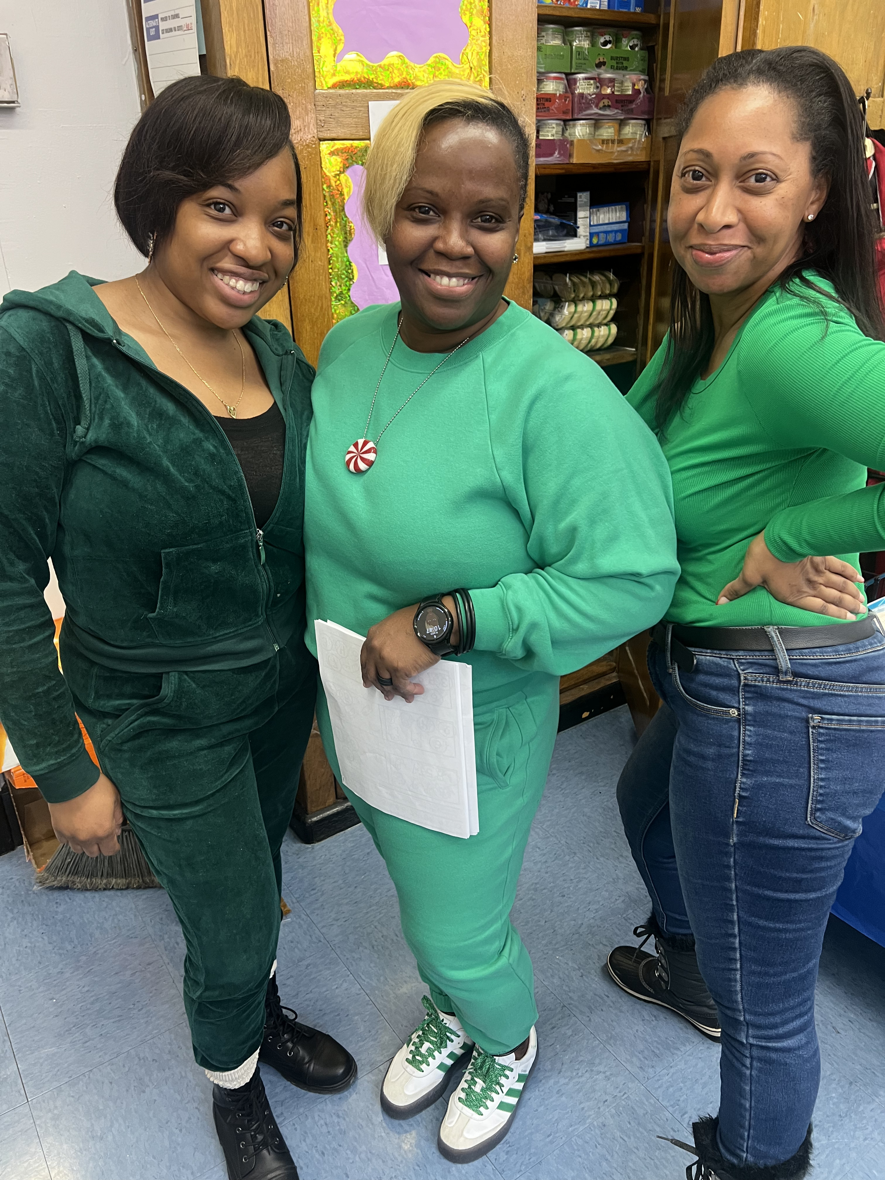 Five children standing on a polished gym floor 
