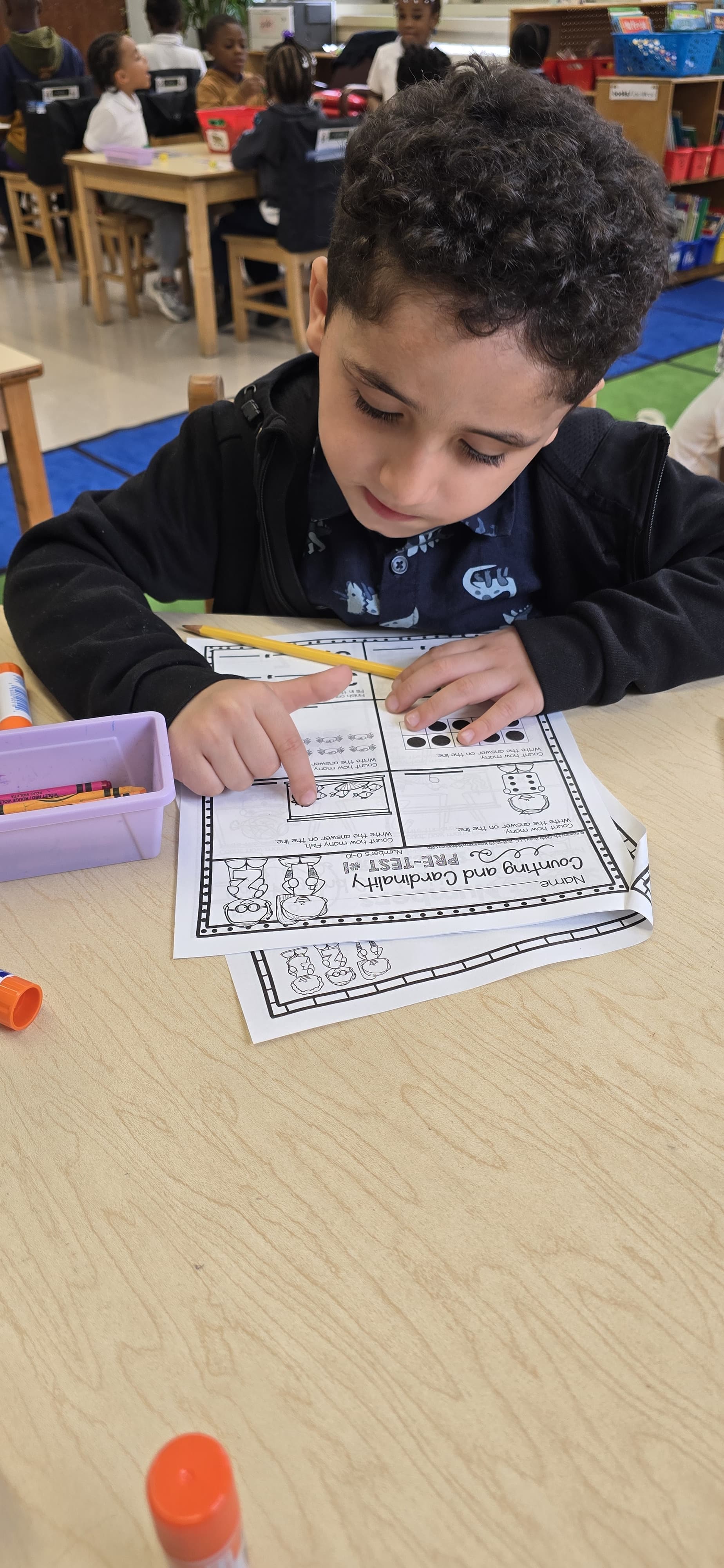 Five children standing on a polished gym floor 