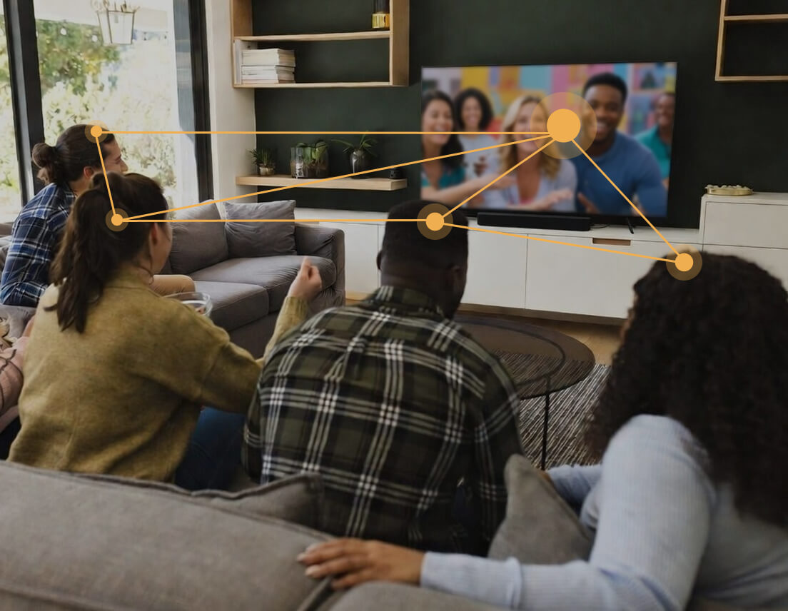 Image of 4 people watching TV with graphic lines connecting them to indicate connection