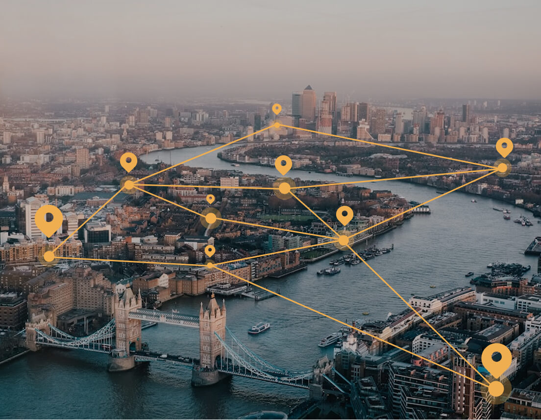 Aerial view of London with graphic lines and pinpoints showing network connections