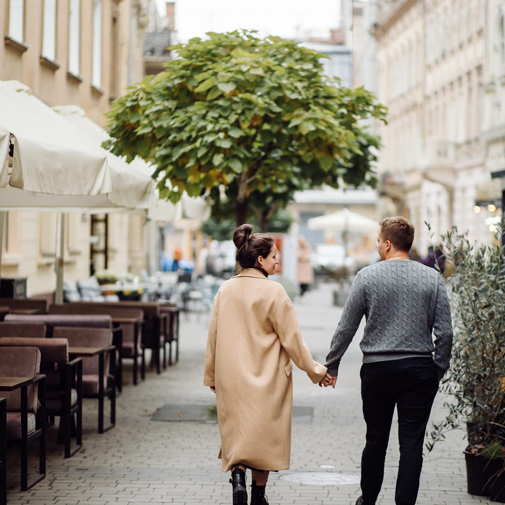 person walking down a shopping street in paris france