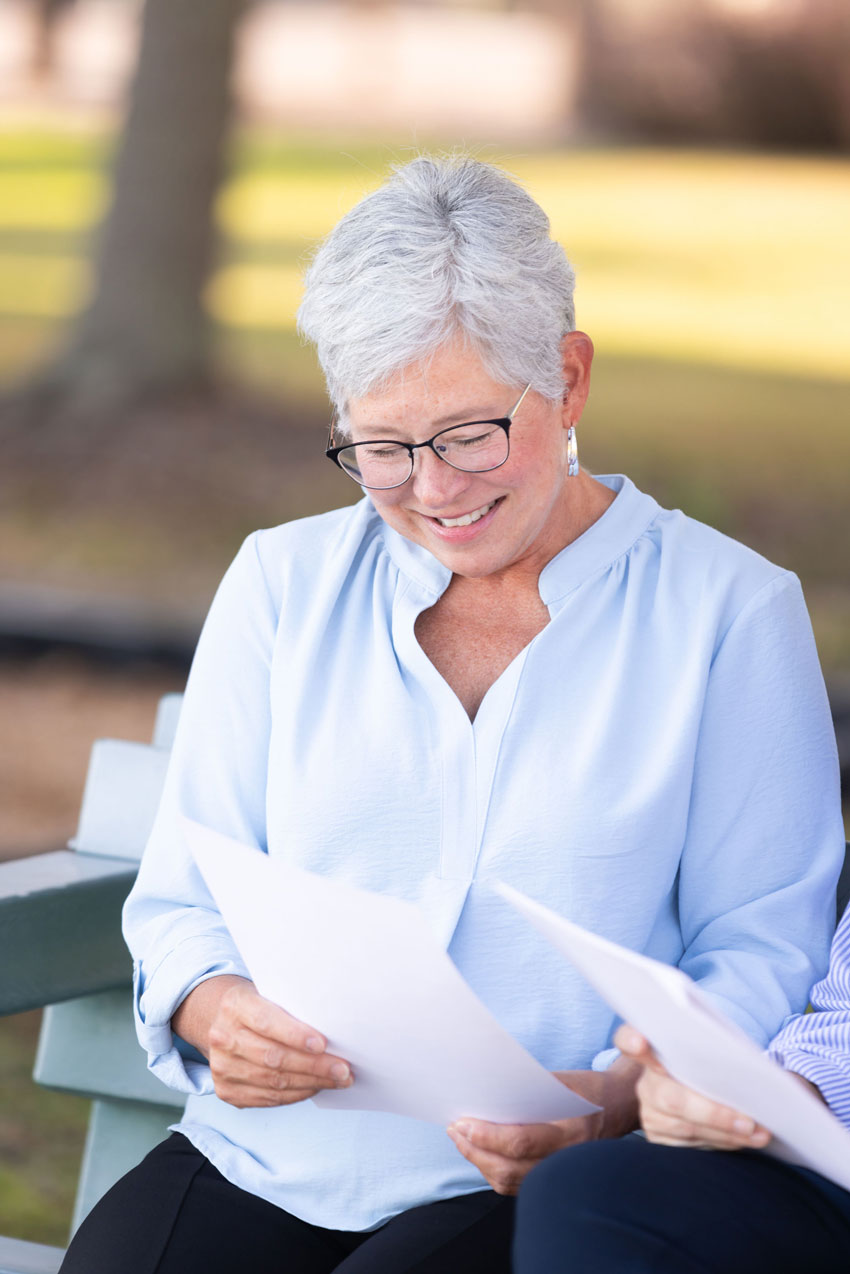 Older adult reviewing care documents with an aging advocate in Tampa Bay