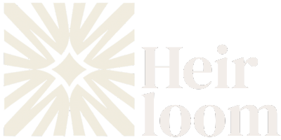 Heirloom brand logo featuring a stylized starburst design to the left of the word 'Heirloom'.