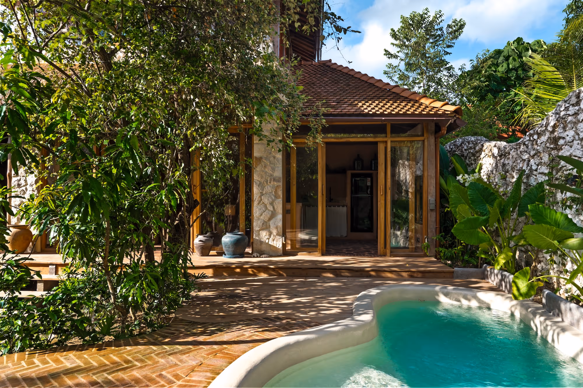 Stone and wood villa with sliding glass doors