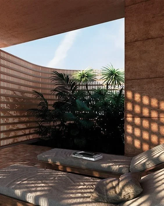 Brick-lattice partition filtering light in a Bali villa interior by MAR MAR Studio