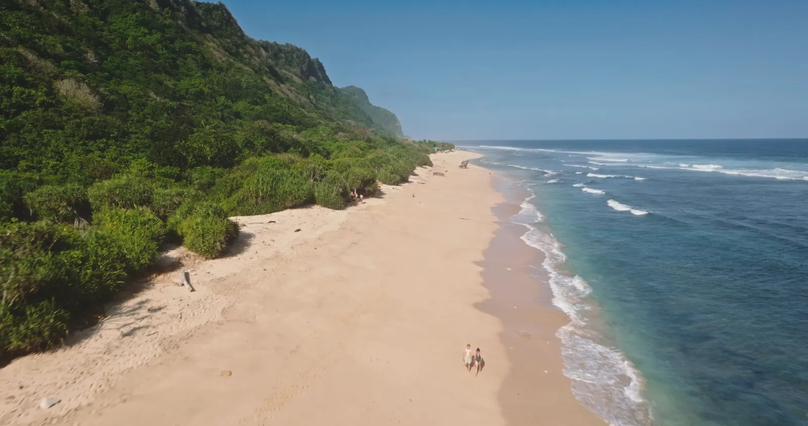 Nyang Nyang Beach, a wide white-sand beach below the cliffs in Uluwatu, Bali