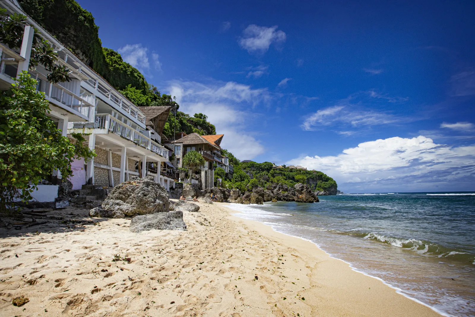 Bingin Beach in Uluwatu, Bali — limestone cliffs above a white-sand cove