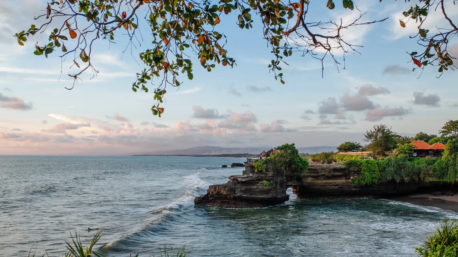 Batu Bolong Beach in Canggu, the busiest black-sand surf stretch on the coast
