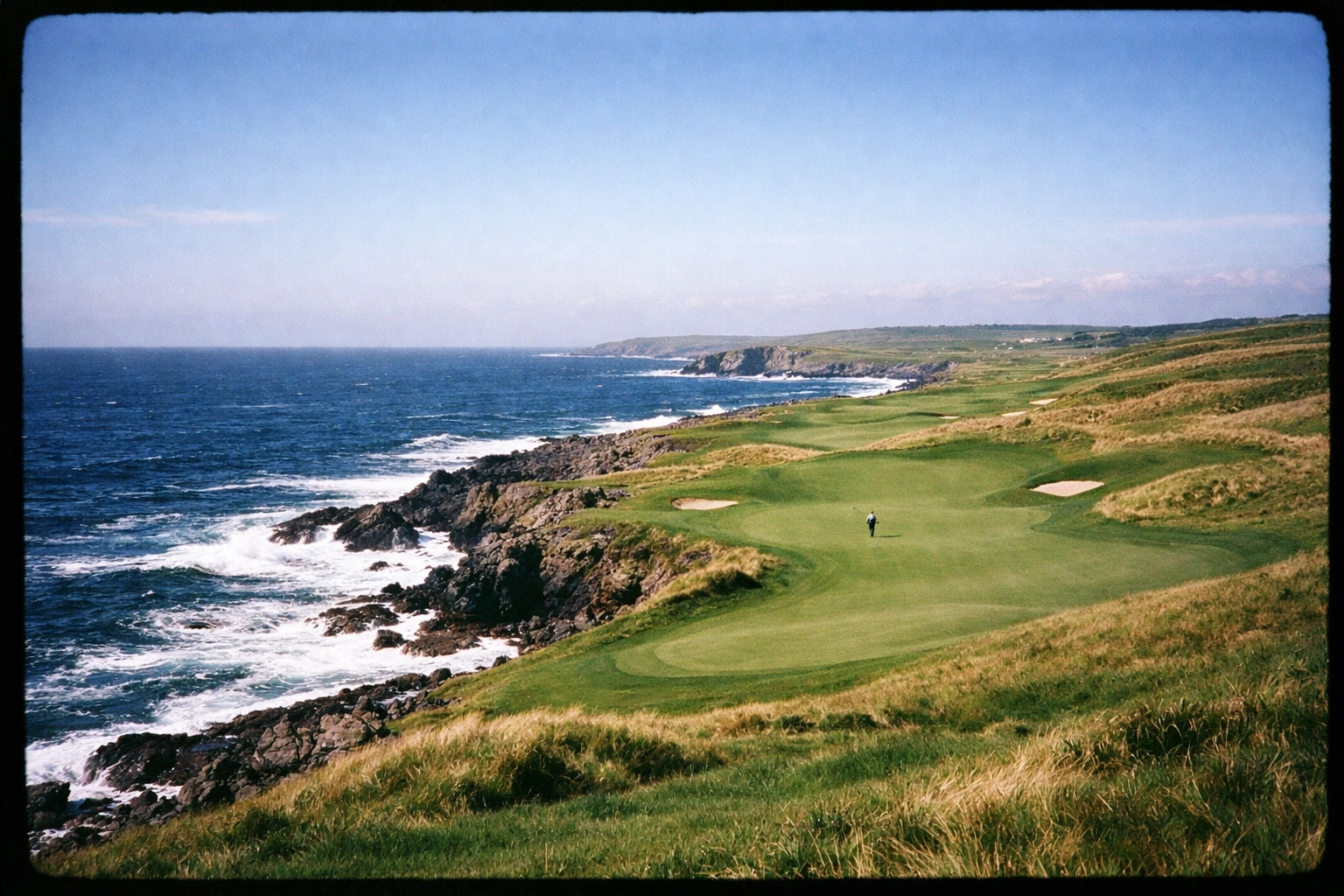 A stunning world-class links golf course along a rugged coastline, a dream destination for international golf travel.