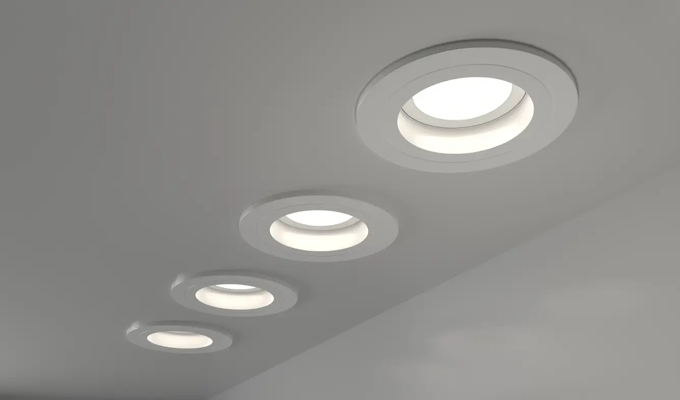 Security Lighting in Flagler Beach, FL 1 Row of five round recessed LED downlights in smooth white ceiling.