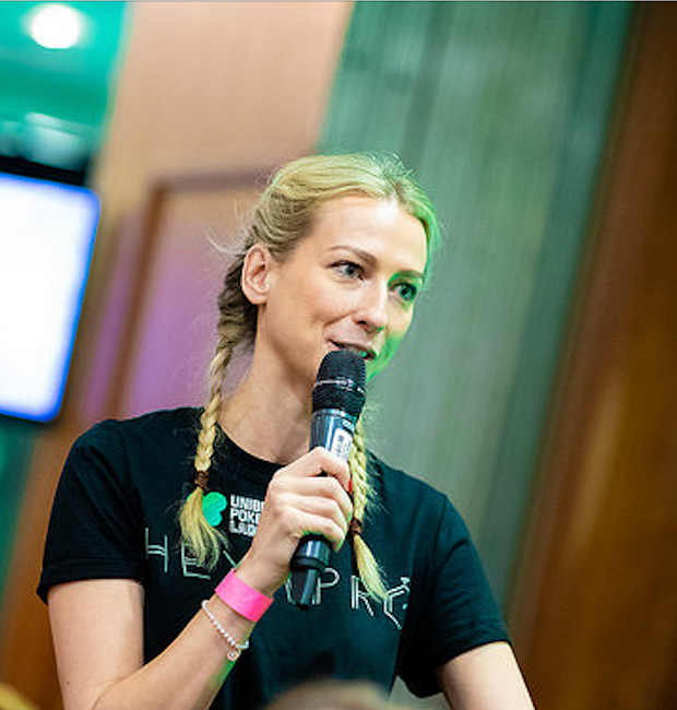 Professional poker speaker delivering a talk on strategy and leadership at a corporate event.