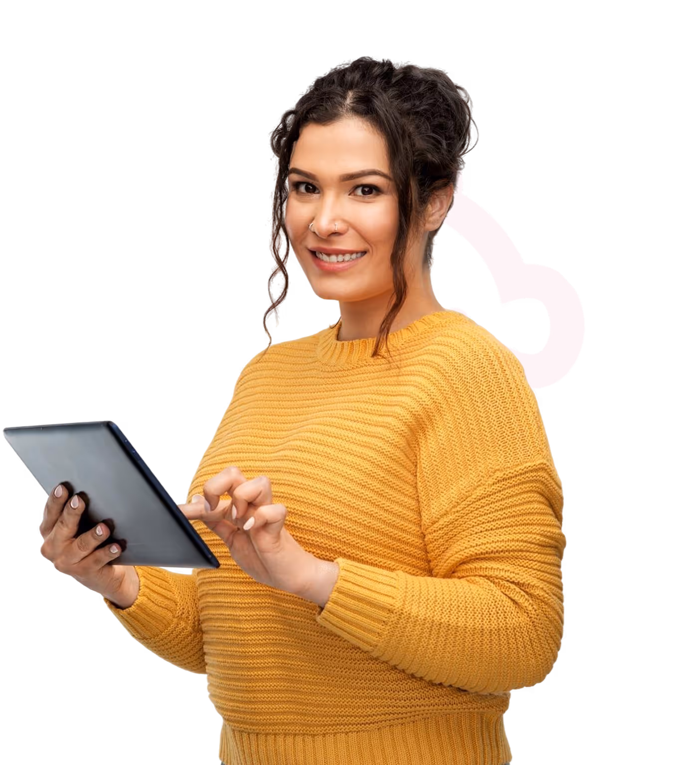Smiling woman in yellow sweater using a tablet with curly hair and nose piercings.