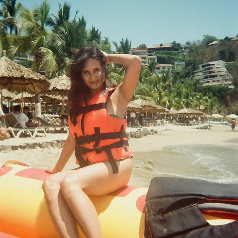 Solo traveler taking in the ocean view at a WNDRLUST destination