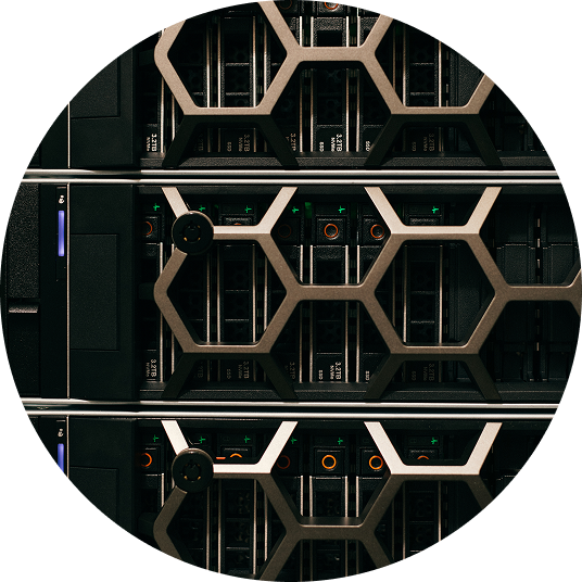 Close-up of server racks with hexagonal metal grills and visible network hardware inside.