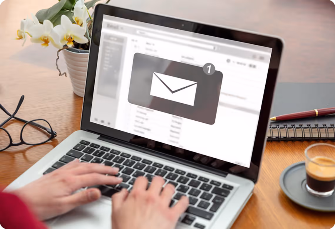 Woman completing online gym membership on laptop at home