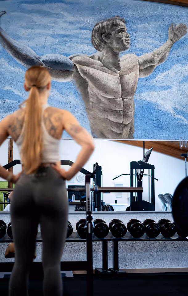 Collection of images showing modern cardio machines, strength training area, and stylish gym interior.