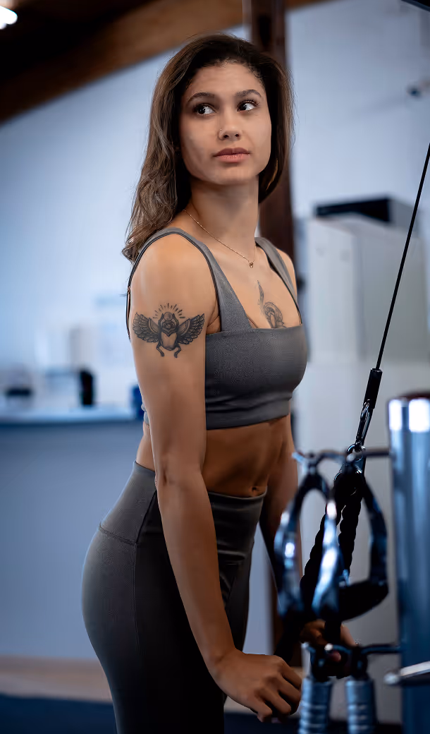 Collection of images showing modern cardio machines, strength training area, and stylish gym interior.
