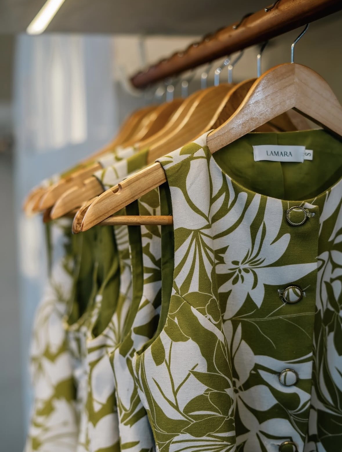 [background image] image of contact details on a board for a clothing boutique