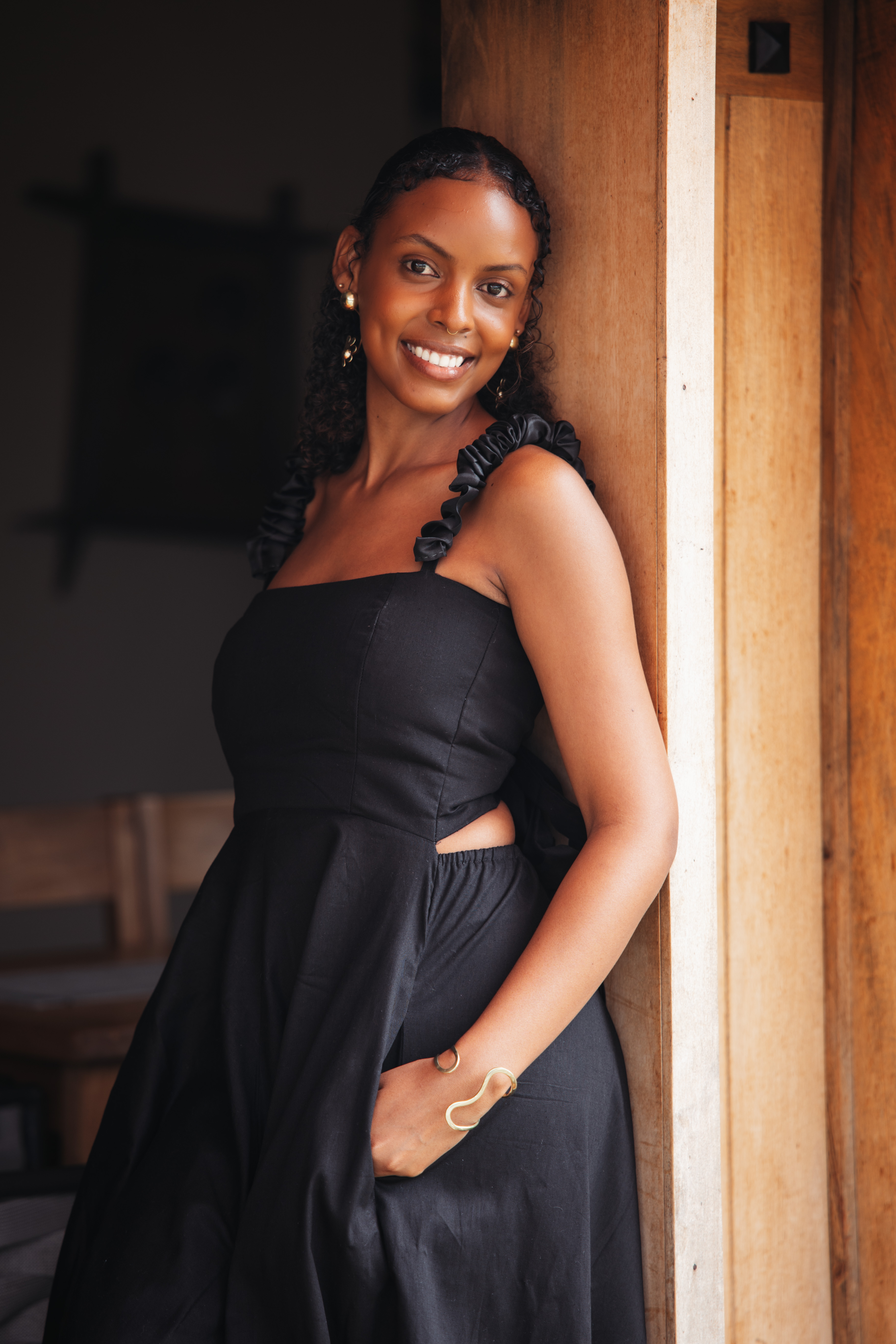 image of a tailor adjusting a dress on a mannequin