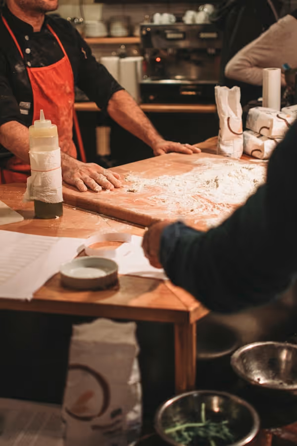 Italian chef, cooking lesson. Food, flour and vegetables
