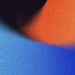 Abstract blurred background with gradient colors blending blue, black, and orange tones.
