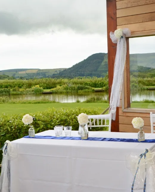 Wedding ceremony seating with lake views at Sunset Lakes events venue