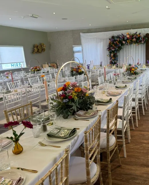 Wedding ceremony with wooden pergola overlooking fishing lakes