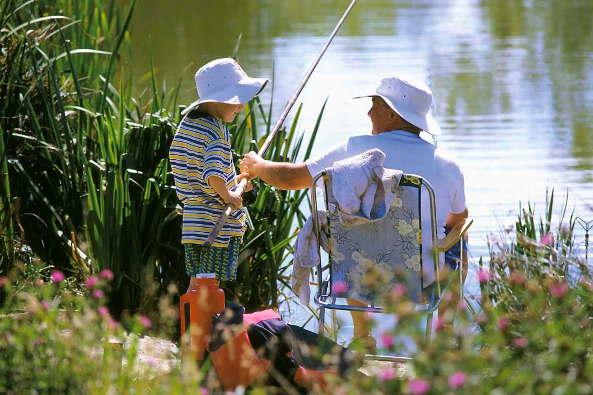 Angler on fishing platform at Sunset Lakes coarse fishing venue