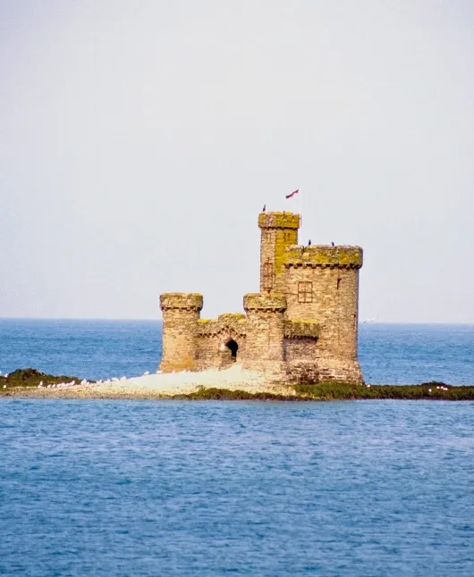 Tranquil Isle of Man glen with stream and woodland