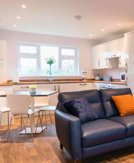 Modern lodge exterior at Sunset Lakes with private entrance and parking