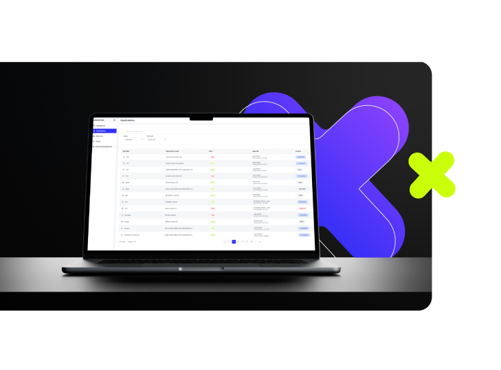 Laptop on a desk displaying an application management interface with a list of applications and their statuses.