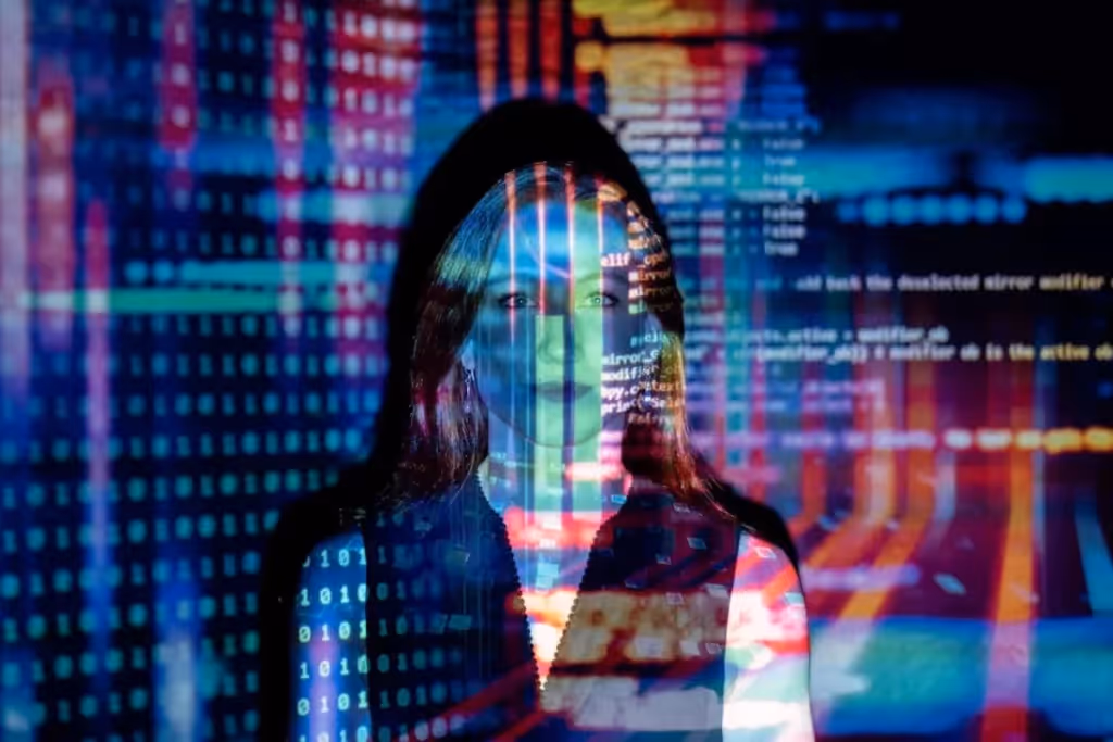Woman's silhouette overlaid with colorful digital code and circuitry on a dark background.