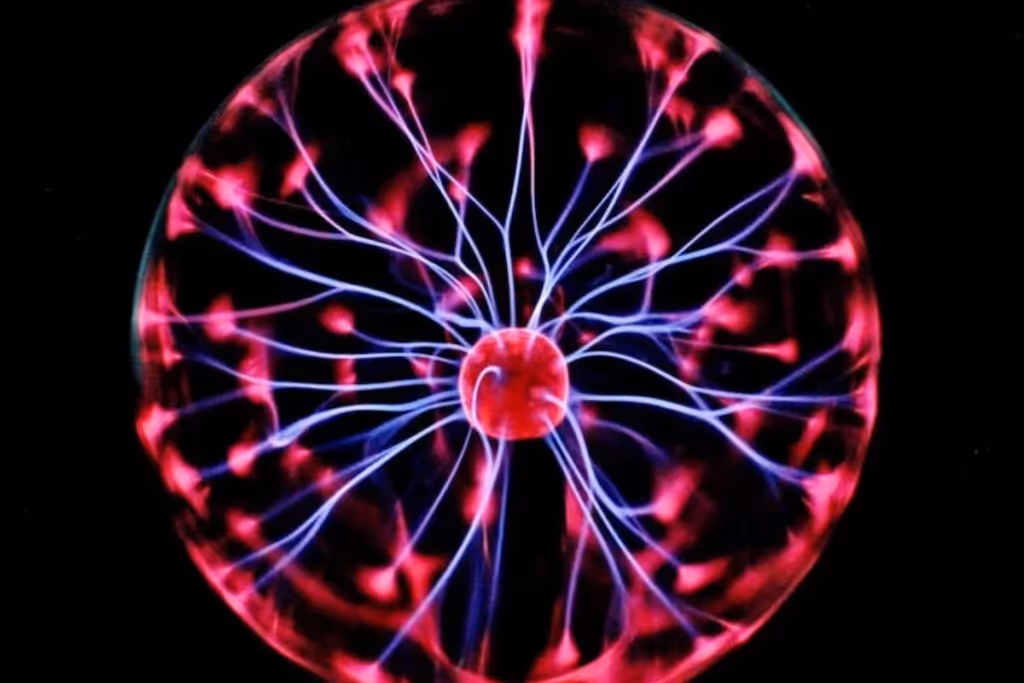 A plasma ball with glowing blue and pink tendrils emanating from the central sphere.