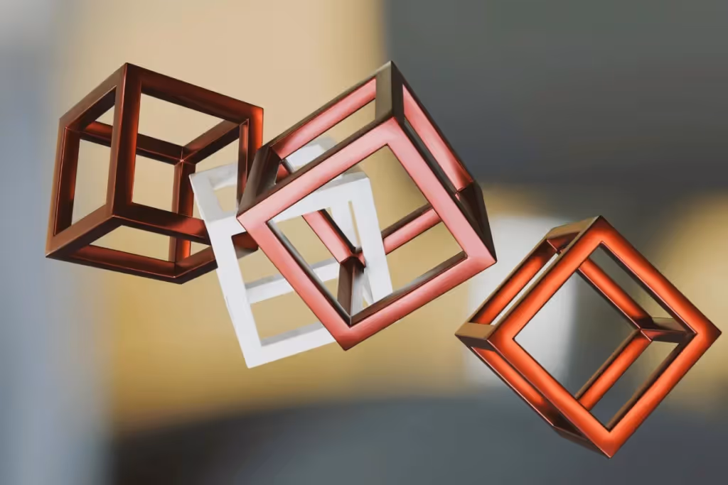 Contemporary design of interlocking red and white metal cubes in mid-air.